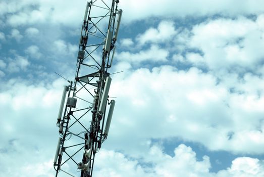 Tower with Cellular (Mobile) Equipment on Cloudy Sky Background. Communication Concept