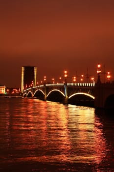 View of drawbridge across Neva river in Saint Petersburg at night, Russia