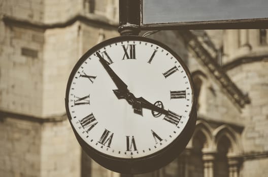 An old vintage clock  fixed to wall