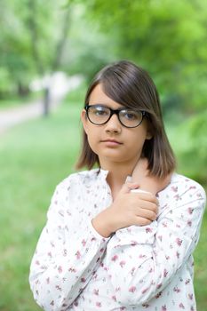 Girl in a stylish black sunglasses outdoors