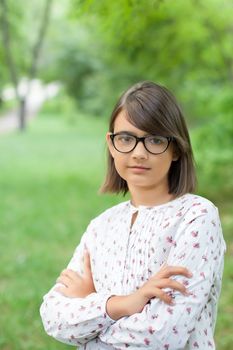 Girl in a stylish black sunglasses outdoors