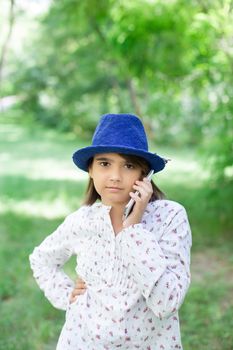 Girl with a mobile phone in the country