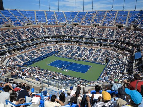 A crowded Arthur Ashe Stadium for a 2014 U.S. Open tennis match, Azarenka vs Makarova.