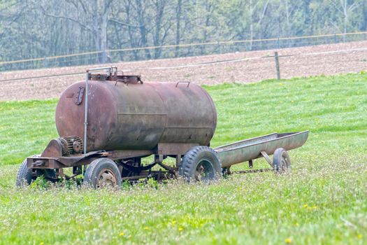 The old cistern forgotten in the pasture for the cows