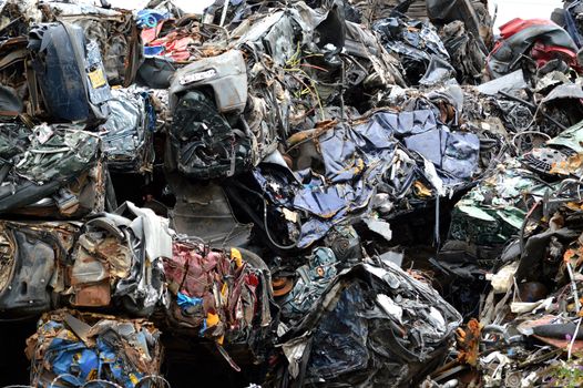 compressed scrap metal including cars