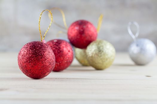 Christmas decoration with bauble ball on wooden table background