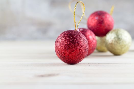 Christmas decoration with bauble ball on wooden table background