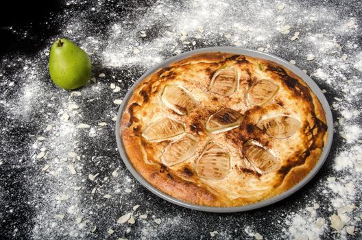 Sweet tasty pie with green pear and almonds.