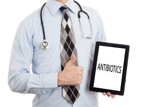 Doctor, isolated on white backgroun,  holding digital tablet - Antibiotics