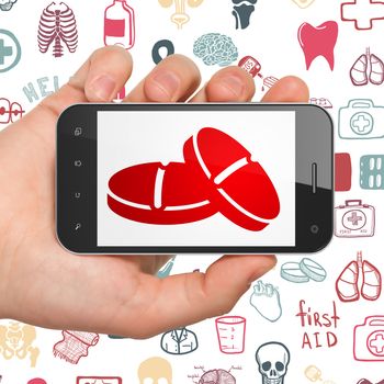 Medicine concept: Hand Holding Smartphone with  red Pills icon on display,  Hand Drawn Medicine Icons background, 3D rendering