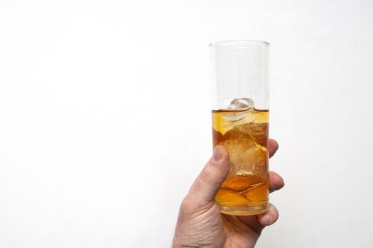 man holding glass of alcoholic drink