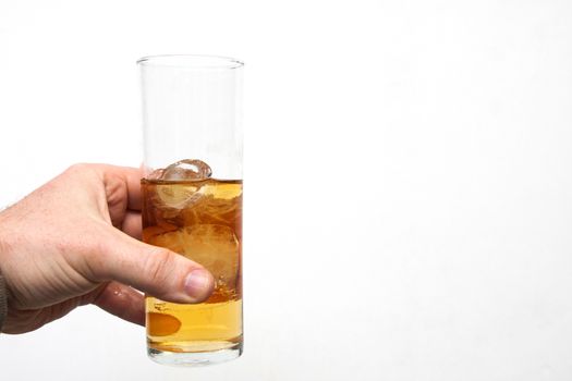 man holding glass of alcoholic drink