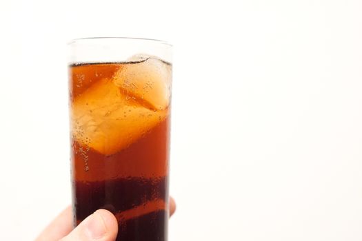 man holding glass of alcoholic drink