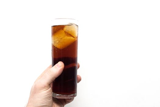 man holding glass of alcoholic drink