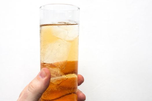 man holding glass of alcoholic drink