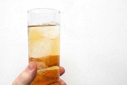 man holding glass of alcoholic drink