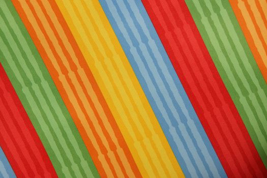 Abstract colorful background stripe textile texture. Macro photo.