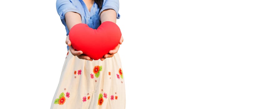 Isolated girl presenting or giving big red heart on white background