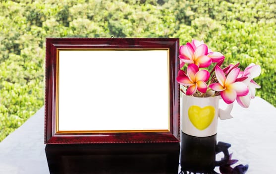 Classic burnt dark brown colour blank picture frame with flowers and tree background