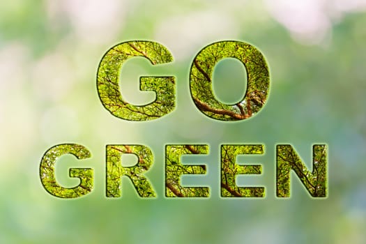 Text go green with tree bush texture inside font on natural soft bokeh background