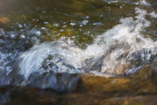 Water splash in river and sunlight on surface for nature background