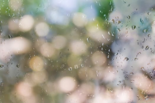 Romantic tree bokeh and water drop on glass mirror plate abstract valentine background