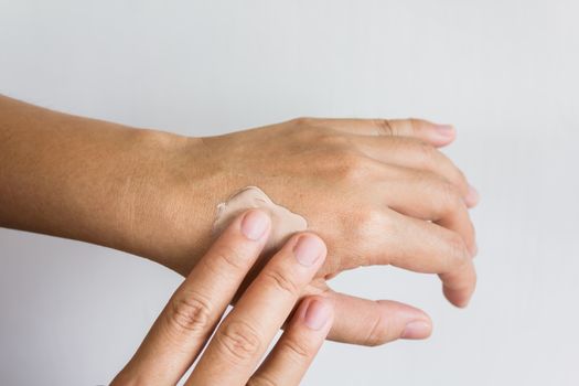 Women dry hands, apply skin care or lotion
