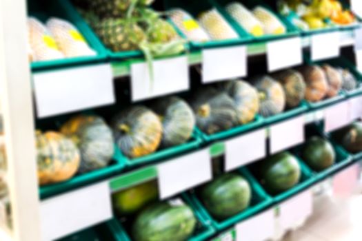 Blurred background fruits shelf in supermarket