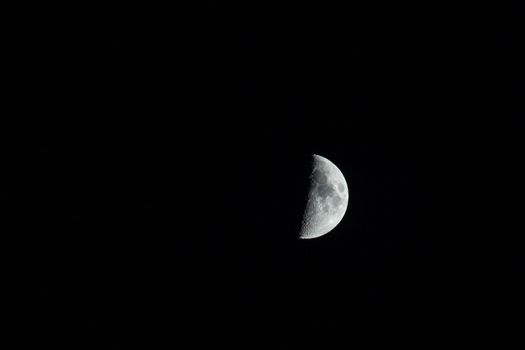 The silver half moon isolated on black. .