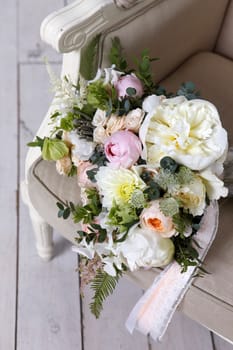 Beautiful wedding bouquet, forgotten on a vintage chair