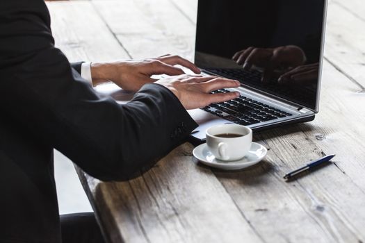 Business man working with laptop computer in office