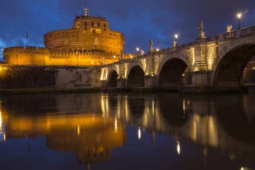Castel Sant' Angelo and Ponte Sant' Angelo reflecting onto the River Tiber at twilight, Rome, Italy, Europe