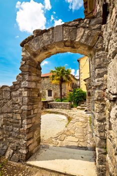 Town of Hum stone gate and street vertical view, Istria, Croatia