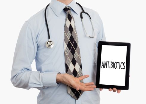 Doctor, isolated on white backgroun,  holding digital tablet - Antibiotics