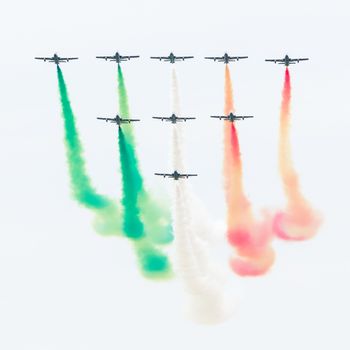 LEEUWARDEN, THE NETHERLANDS-JUNE 10, 2016: Italian aerobatic team Frecce Tricolori (Tricolor arrows) performs a show at the Dutch Airshow on June 10, 2016 at Leeuwarden Airfield, The Netherlands.