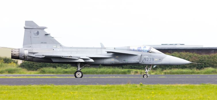 LEEUWARDEN, THE NETHERLANDS-JUNE 10: Modern tactical fighter jet JAS-39 Gripen performs at the Dutch Airshow on June 10, 2016 at Leeuwarden Airfield, The Netherlands.