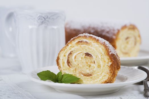 Biscuit roll with jam on a table, selective focus