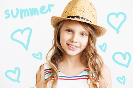 Closeup portrait of a lovely little girl with straw hat against a white background