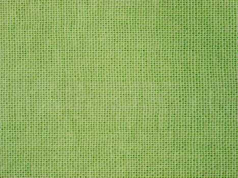 Natural green cotton fabric weaving close up as background texture