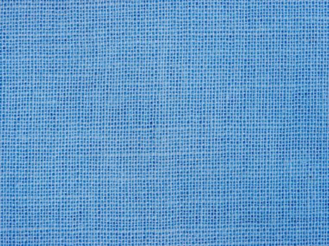 Natural blue cotton fabric weaving close up as background texture