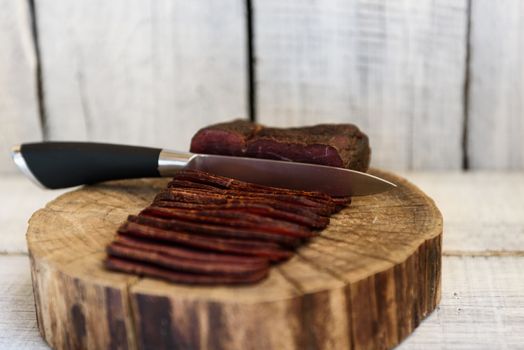 pastrami knife on a wooden table