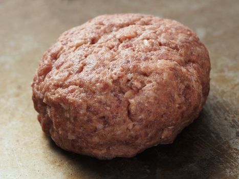 close up of rustic uncooked hamburger patty