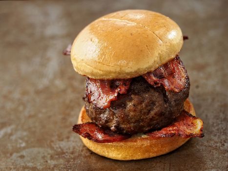 close up of rustic carnivore meat lover hamburger