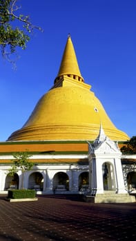 Prapathom chedi pagoda temple with blue sky vertical in Nakorn Pathom, Thailand