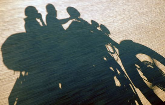 Amazing silhouette of couple on countryside road, summer  journey of backpacker of motorcycle to adventure Vietnam landscape, strong man ride motor on street, Asia couple travel together by motorbike