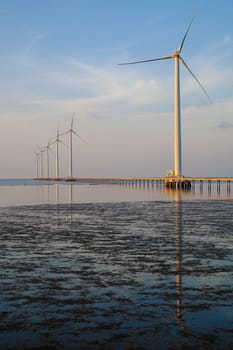 Group of wind turbines of Bac Lieu wind power plant at Mekong Delta, Vietnam. Windmill at Baclieu seaside at morning, make clean energy for Viet nam industry