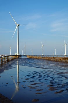 Group of wind turbines of Bac Lieu wind power plant at Mekong Delta, Vietnam. Windmill at Baclieu seaside at morning, make clean energy for Viet nam industry