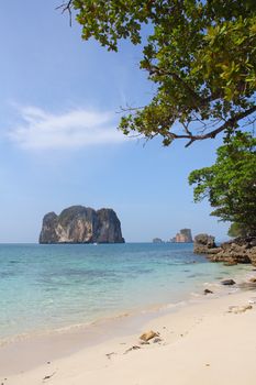 View on beautiful beach, sea and limestone island in Thailand
