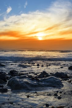 reflections at rocky beal beach near ballybunion on the wild atlantic way ireland with a beautiful yellow sunset