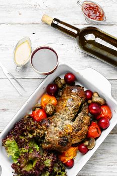 Form baked meat loaf of veal with plum sauce,seasoning and wine